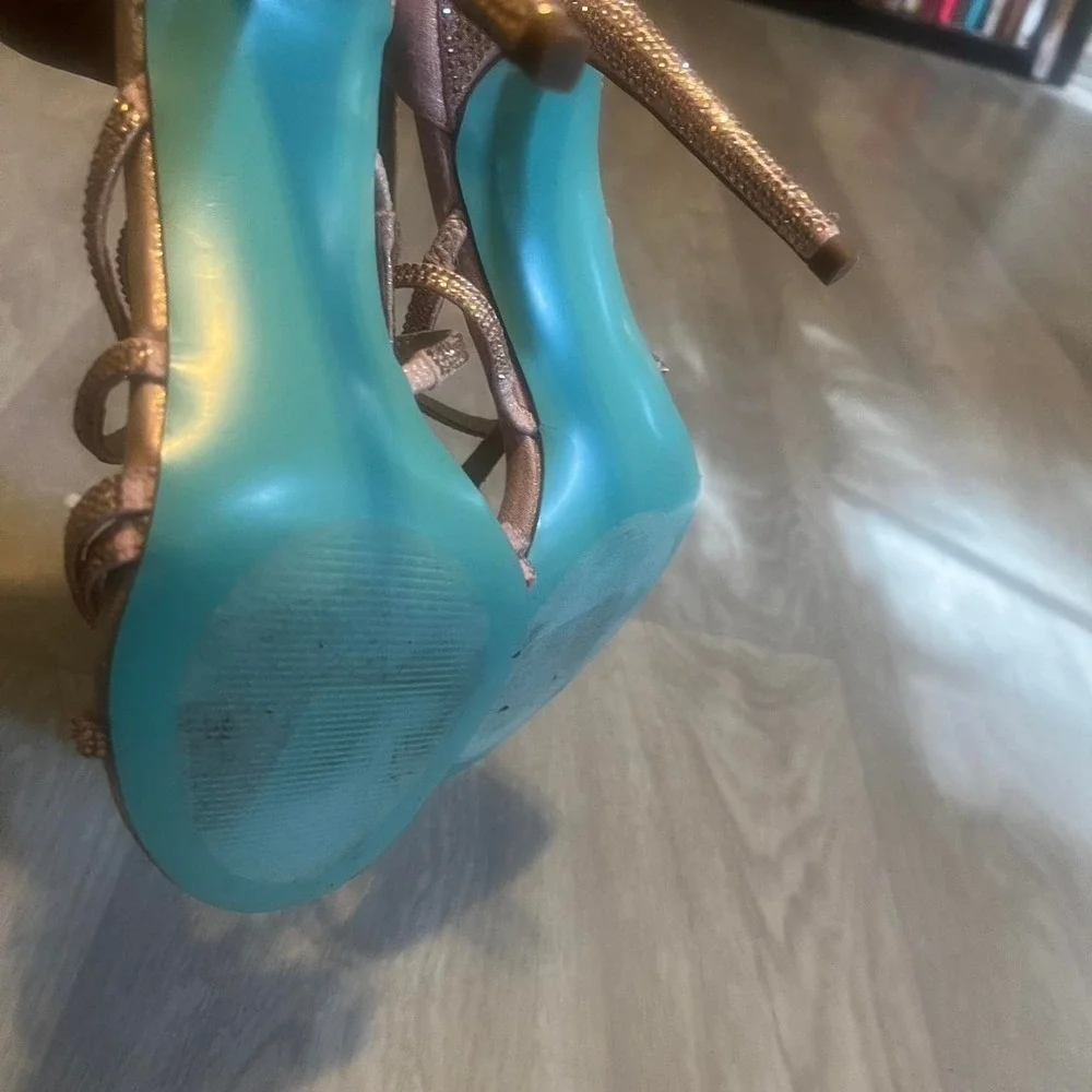 Betsy Johnson Rose gold strappy heels with rhinestones and blue bottom.